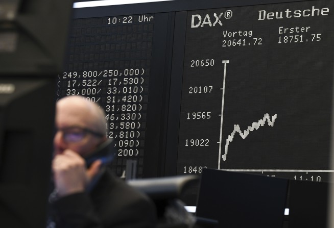 The Latest: US stock market closes lower after Trump's latest tariff threats