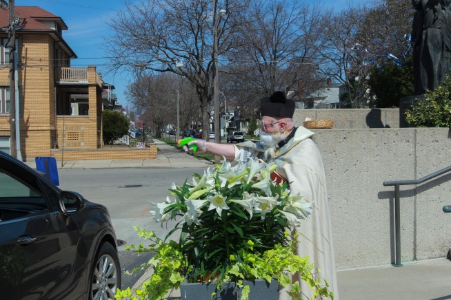 Priest draws squirt gun in fight against coronavirus