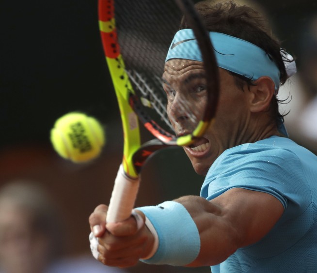 Nadal wins 11th French Open title by beating Thiem in 3 sets