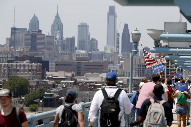 Pro-Sanders demonstrators march in the sweltering heat