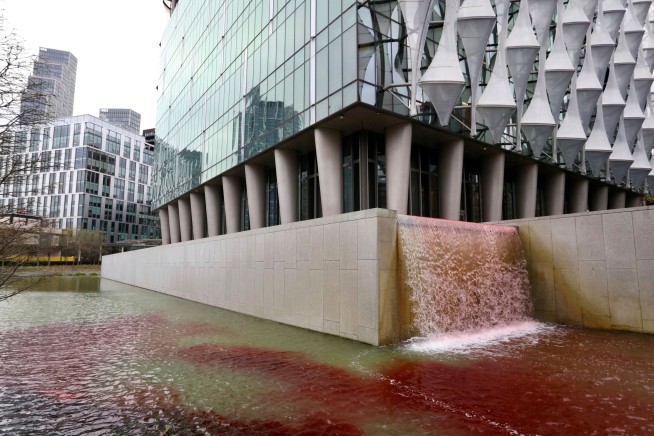 Greenpeace activists arrested in London after red dye poured into US Embassy pond