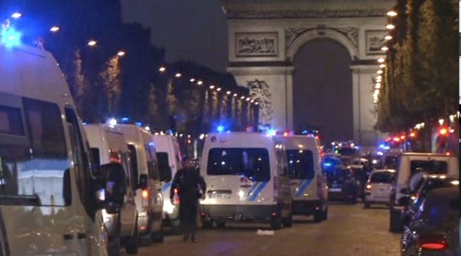 Paris police say officer and attacker shot, killed