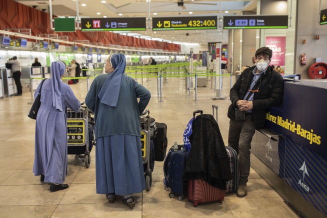 WHO declares virus crisis a pandemic, urges world to fight