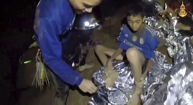 Rescuers race to drain water inside Thai cave before rains