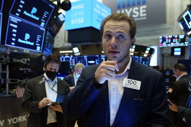 Stocks end mixed after Fed notes progress on the economy