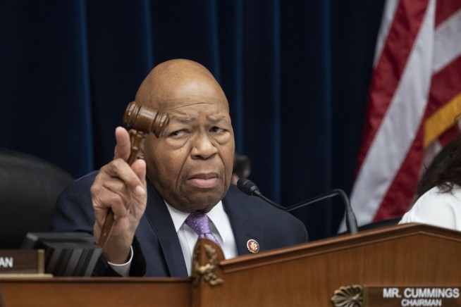 Stepping up feud, Trump assails Cummings as 'racist'