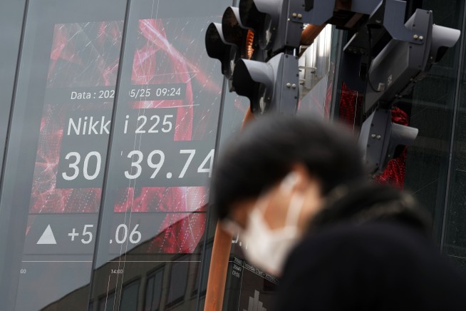 Stock market today: Asian shares extend losses, while Japan's Nikkei pushes higher