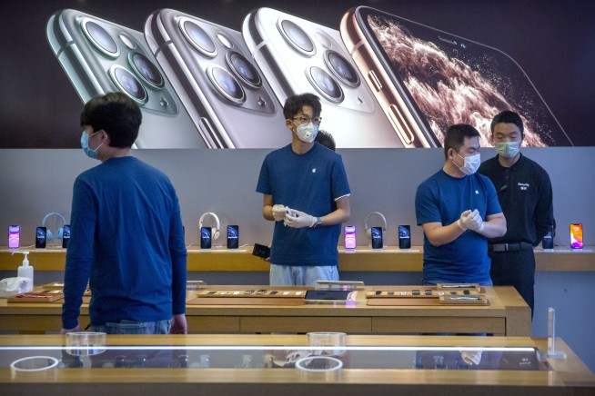 Apple warns China virus will cut iPhone production, sales