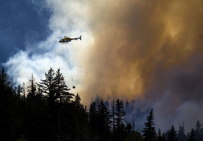 The Latest: Colorado wildfire destroys more than 100 homes