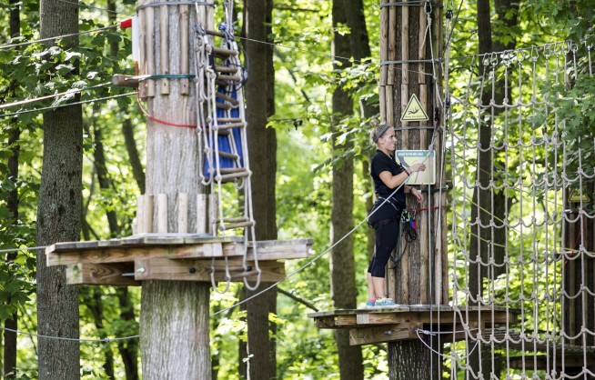 Zip line company: Woman who fell had unhooked safety gear