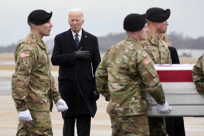 Hand over heart, Biden joins grieving families of US troops killed in Jordan as remains arrive home