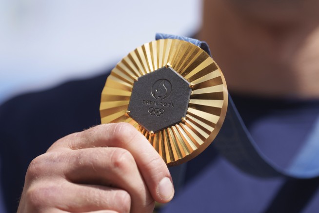 Oleksandr Khyzhniak, Ukraine's gold medal-winning boxer, returns home and lifts spirits amid war