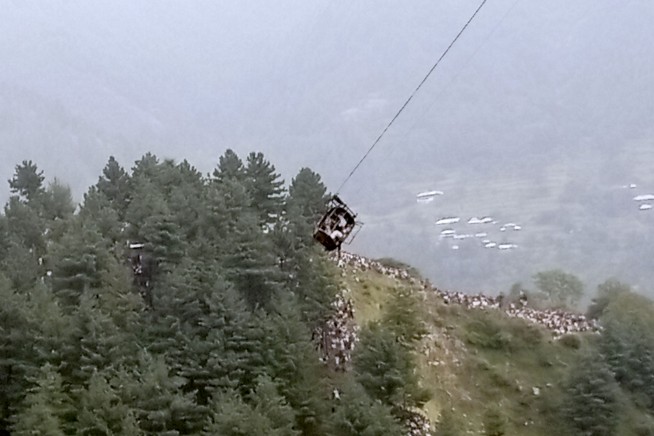 Rescuers save 8 people trapped in cable car dangling above canyon in Pakistan