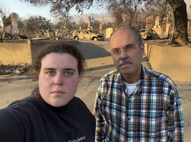 A dad and daughter help evacuees learn whether their homes survived the California wildfires
