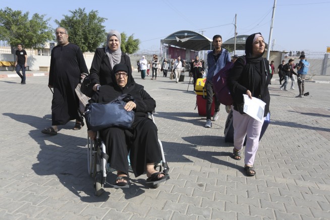 After weeks in besieged Gaza, some foreign nationals and wounded Palestinians are allowed to leave