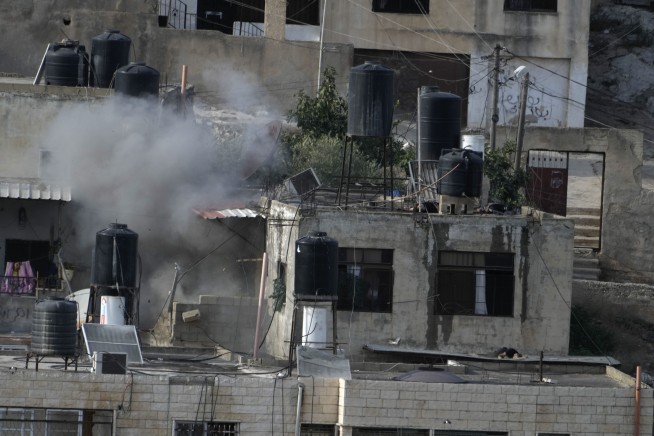 Israeli soldiers pushed 4 apparently lifeless bodies from roofs during a West Bank raid