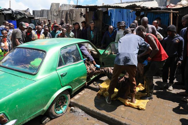At least 25 dead in Kenya after heavy rain brings flash floods and flight disruption to Nairobi