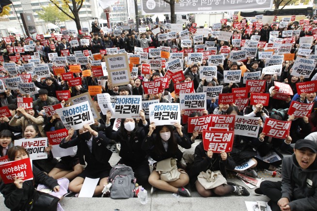 Thousands of protesters demand that SKorea's president quit