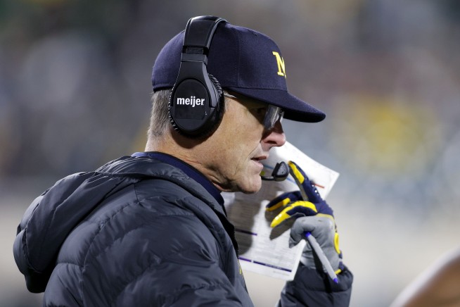 Coach Jim Harbaugh banned from 3 games over sign-stealing allegations. Michigan asks judge for stay