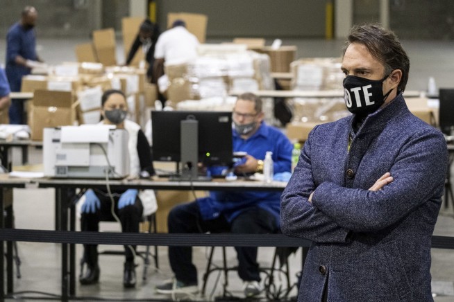 Election workers accused of shredding voter applications