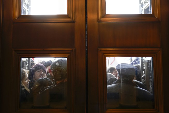 The Latest: 2 Capitol Police officers suspended after attack