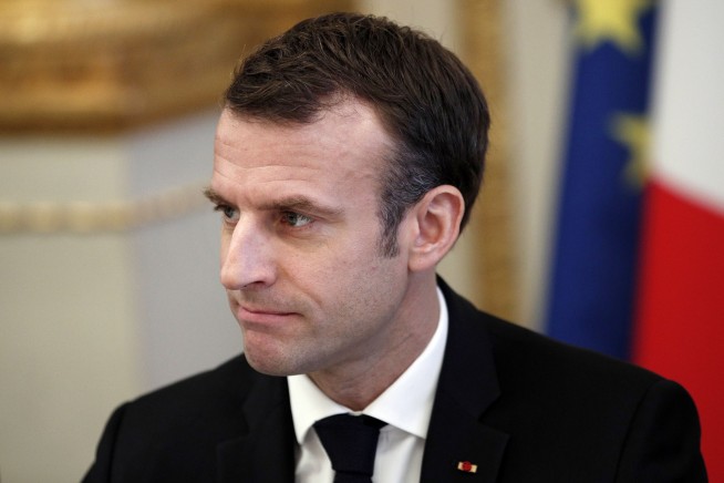 Macron vows tax relief, urges calm in bid to quell protests