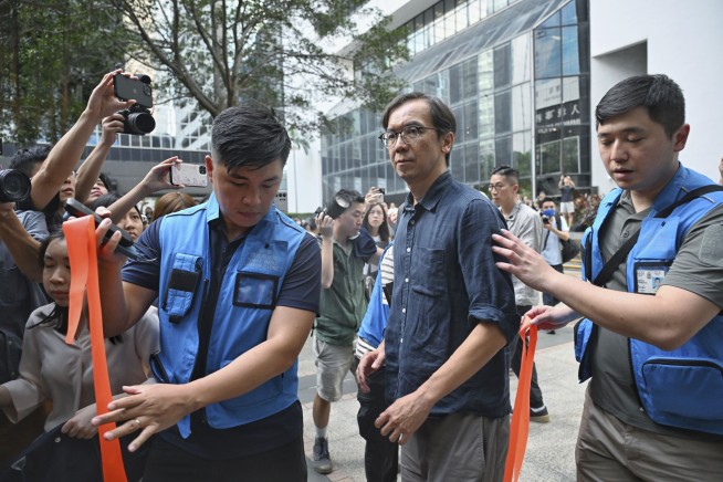 A Hong Kong court convicts 2 journalists in a landmark sedition case