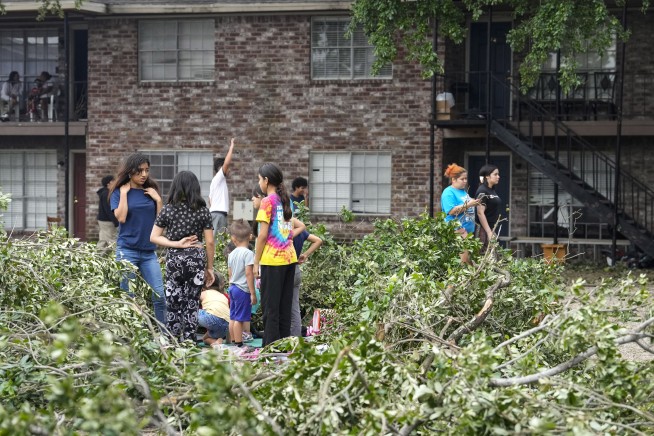 Some in Houston facing no power for weeks after storms cause widespread damage, killing at least 4