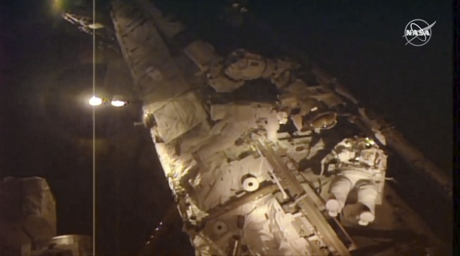 Spacewalking astronauts close to fixing cosmic ray detector