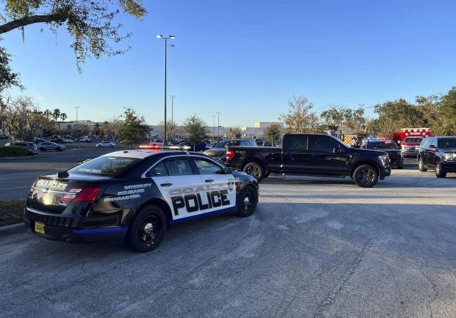 A man is killed and a woman injured in a 'targeted' afternoon shooting at a Florida shopping mall