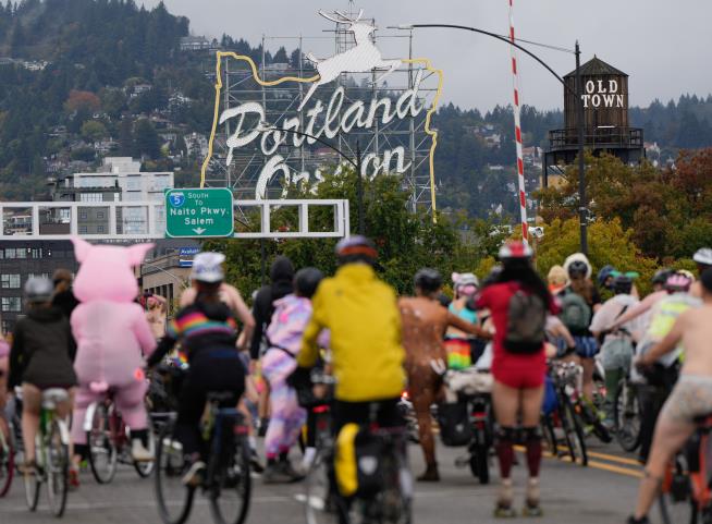 Naked bike riders demonstrate against federal troops in 'quintessentially Portland' protest