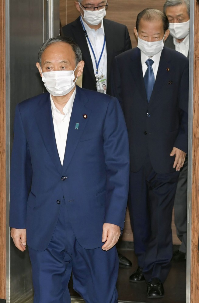 Suga bows out of party vote, paves way for new Japan PM
