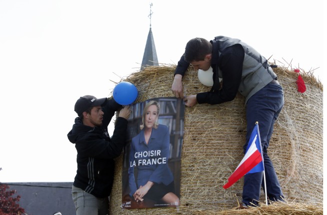 Hacking arrest, fake news in tense French presidential race