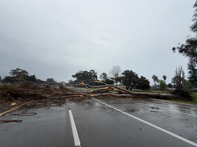 California walloped by winter storm with high winds and heavy rain and snow