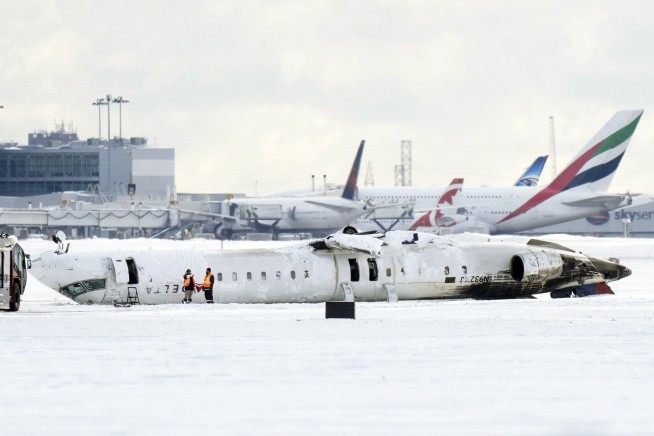 Questions emerge about what may have caused Delta plane to burst into flames and flip over