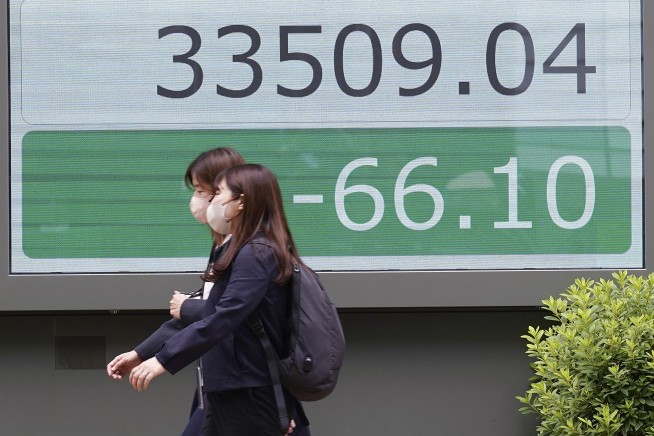 Stock market today: Asian shares mixed after Fed chair inflation comments