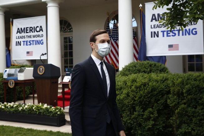 Skipping a mask, Trump says he's 'met the moment' on testing