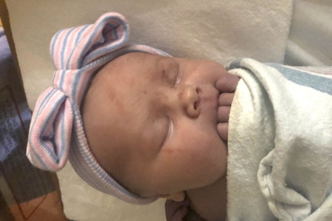 Michigan couple with 14 sons welcome their first daughter