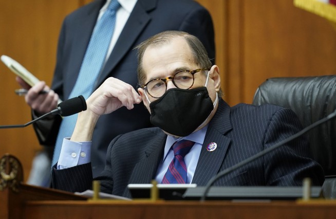 House votes to curb power of presidency on travel bans