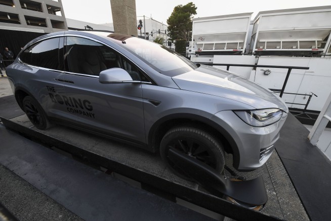 Elon Musk unveils underground tunnel, offers rides to VIPs