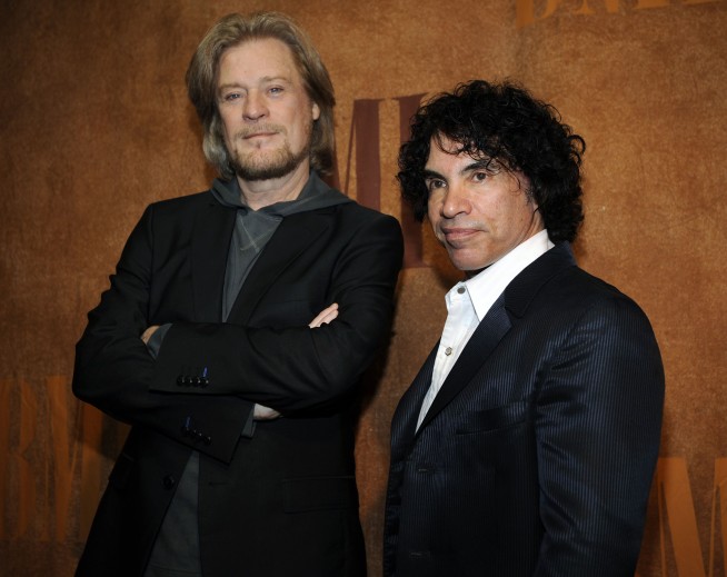 Daryl Hall is suing John Oates over plan to sell stake in joint venture. A judge has paused the sale