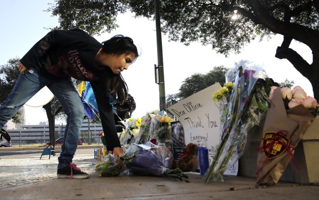 Authorities say Texas, Missouri officers shot in ambushes