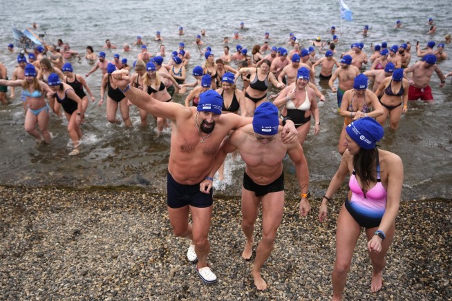Cold-water swimmers in the Czech Republic set a new world record for the largest polar bear dip