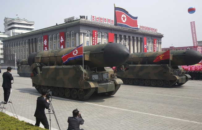 North Korea flaunts long-range missiles in massive parade