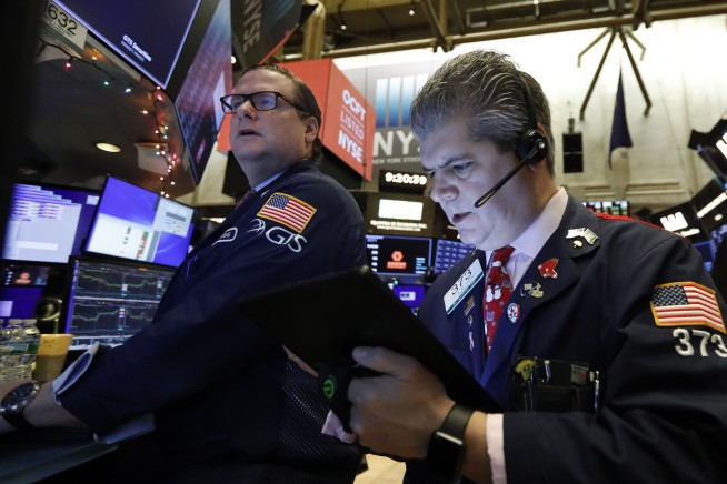 US stocks close in on record highs; Nasdaq goes above 9,000