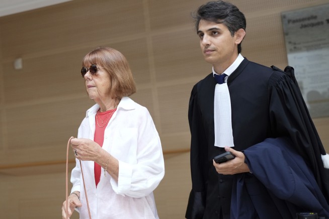 A French woman whose husband is accused of inviting men to rape her testifies in court