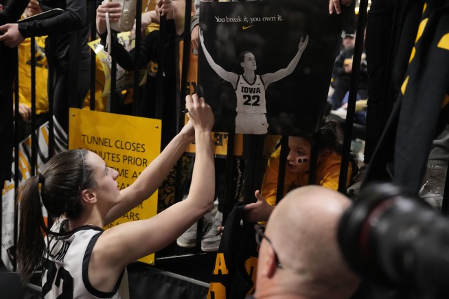 Caitlin Clark of Iowa breaks the NCAA women's career scoring record with a signature 'logo 3'