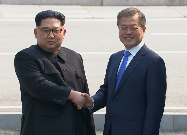 The Latest: Koreas agree to stop cross-border hostile acts