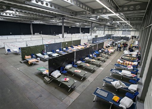 The Latest: 2 dead, 47 migrants rescued off Greek island