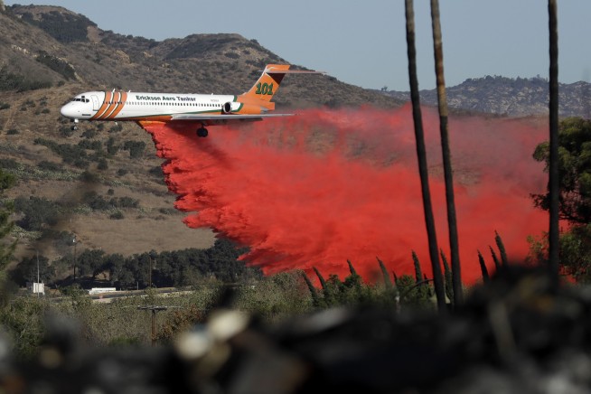 The Latest: California governor: Fires are 'new reality'
